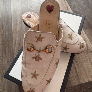 Gucci Women's Cream Mules with Gold Embellishments
